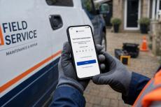 A worker checking two-factor authentication on smartphone